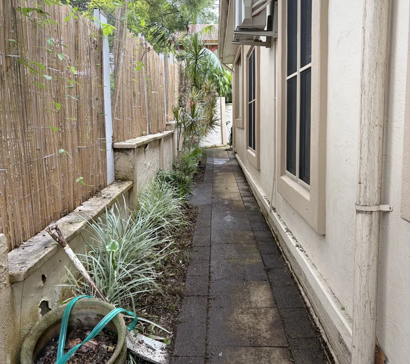 After, side path cleared and weeded, by Golden Landscaping